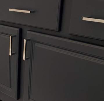 gal- crop of black cabinets with modern handles