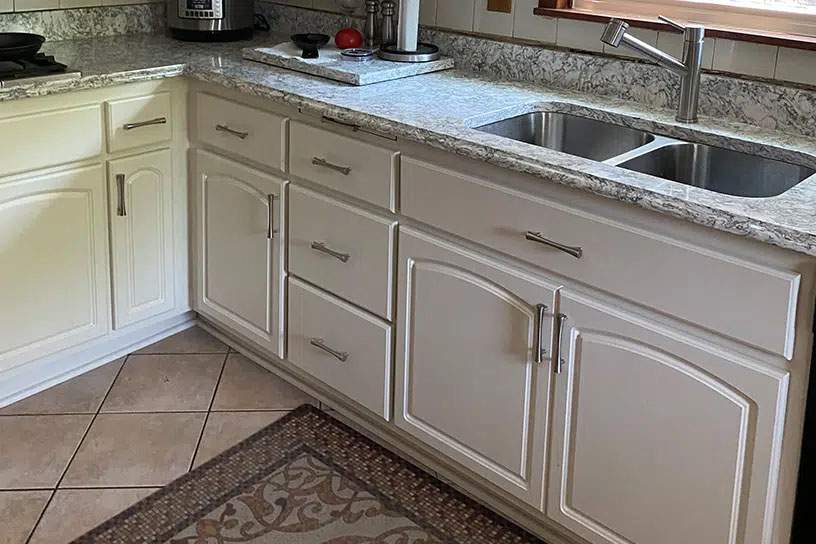 after cabinet resurfacing in white with sink