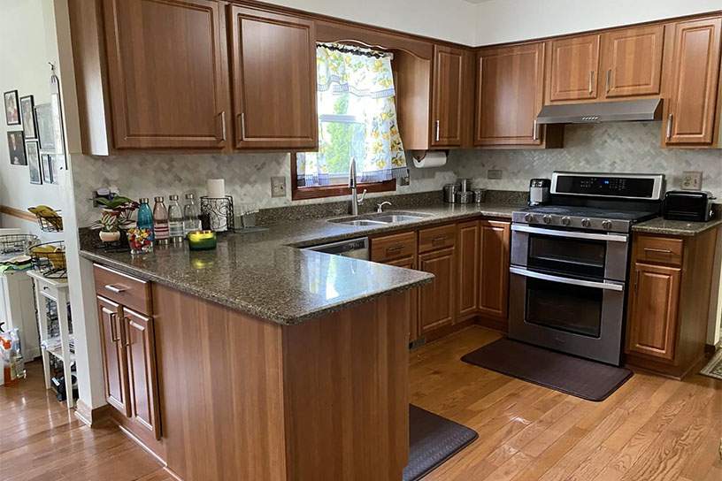 khan residence after- updated brown wooden cabinertry