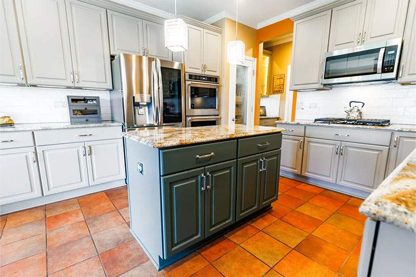 kitchen with resurfaced light grey cabinetry