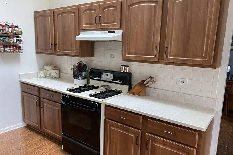 ttalbot residence- resurfaced brown wooden cabinetry